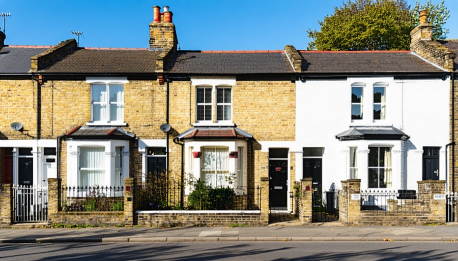 Illustration of UK houses with a rent price tag and salary chart
